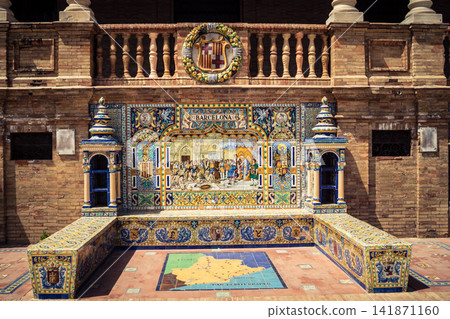 General view of ceramic tile bench alcove with coat of arms at Plaza of Spain in Seville General view of ceramic tile bench alcove with coat of arms at Plaza of Spain in Seville 141871160