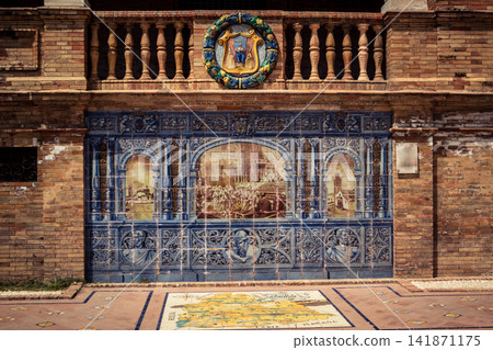 General view of ceramic tile bench alcove with coat of arms at Plaza of Spain in Seville General view of ceramic tile bench alcove with coat of arms at Plaza of Spain in Seville 141871175