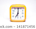 Yellow Retro Alarm Clock Showing 07:00 Time Isolated on Background Vintage Timepiece 141871456