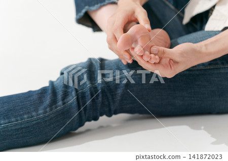 Women who massage their feet Women who massage their feet 141872023