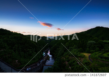Evening view of the Nunome River Valley north of the Nunome Dam embankment in Nara City, Nara Prefecture. 20mm prime lens. The setting sun, part 7. Evening view of the Nunome River Valley north of the Nunome Dam embankment in Nara City, Nara Prefecture. 20mm prime lens. The setting sun, part 7. 141872607