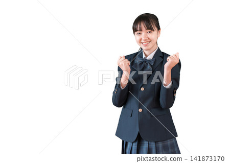 Elementary, middle, and high school girls in blazers making a victory pose. 141873170