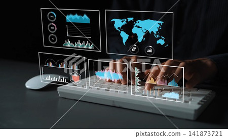 Hands typing on a keyboard with digital analytics and global maps displayed on transparent screens showcasing data visualization and statistical information Gluon Hands typing on a keyboard with digital analytics and global maps displayed on transparent screens showcasing data visualization and statistical information Gluon 141873721