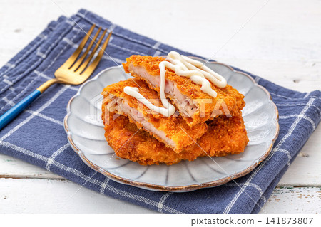 crispy Deep Fried Chicken Cutlet Sliced Golden Breaded Chicken Breast Creamy Sauce Topping crispy Deep Fried Chicken Cutlet Sliced Golden Breaded Chicken Breast Creamy Sauce Topping 141873807
