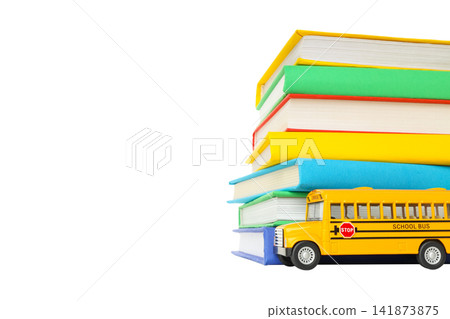 Books and a toy bus await school season, isolated on white, PNG Books and a toy bus await school season, isolated on white, PNG 141873875