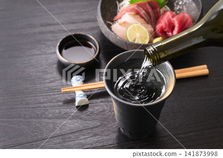 Make a hot shochu drink Make a hot shochu drink 141873998