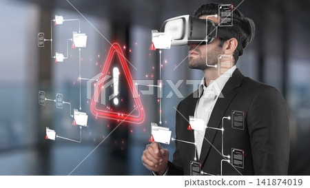 A businessman wearing a virtual reality headset interacts with digital warning symbols and data visualizations, showcasing immersive technology in a modern office setting. Sigmoid A businessman wearing a virtual reality headset interacts with digital warning symbols and data visualizations, showcasing immersive technology in a modern office setting. Sigmoid 141874019