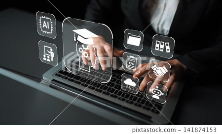 Hands of a business professional typing on a laptop with innovative educational icons and artificial intelligence elements in a modern corporate environment Gluon Hands of a business professional typing on a laptop with innovative educational icons and artificial intelligence elements in a modern corporate environment Gluon 141874153