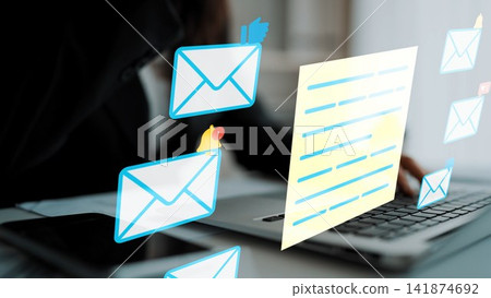 Modern Businessman Working on Laptop with Email Notifications and Digital Communication Icons in Office Environment. Entropy 141874692