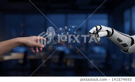 Human and robotic hand interaction in a modern office setting illustrating the future of technology, artificial intelligence, and collaboration between machine and human Synapse Human and robotic hand interaction in a modern office setting illustrating the future of technology, artificial intelligence, and collaboration between machine and human Synapse 141874693