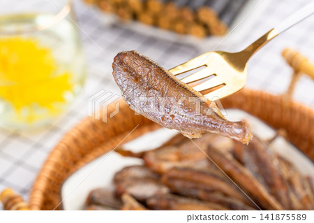 crispy Dried Fish Snack with Golden Fried Texture crispy Dried Fish Snack with Golden Fried Texture 141875589