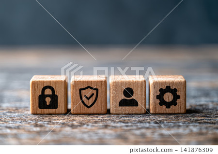 Security icon wooden cube padlock shield user gear close up wooden cube row with padlock shield user gear icons table, soft studio lighting Security icon wooden cube padlock shield user gear close up wooden cube row with padlock shield user gear icons table, soft studio lighting 141876309