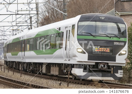 E257 series limited express train running on the Chuo Line E257 series limited express train running on the Chuo Line 141876676