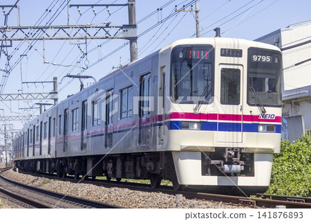 A Keio Line train running through Hino City A Keio Line train running through Hino City 141876893
