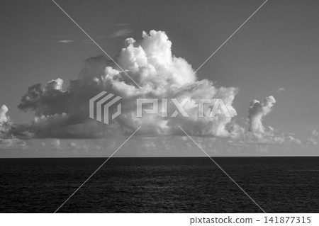 The blue sky and rising white cumulonimbus clouds of Amami Oshima in September. The blue sky and rising white cumulonimbus clouds of Amami Oshima in September. 141877315