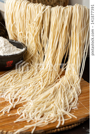 freshly Made Raw White Wheat Noodles Hanging to Dry 141877391