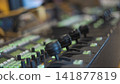 Broadcast switcher control panel with illuminated green buttons and joysticks with copy space 141877819