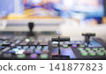 Professional broadcast switcher fader lever with colorful glowing buttons and copy space 141877823