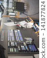 Professional television broadcast control room desk with video switcher and copy space 141877824