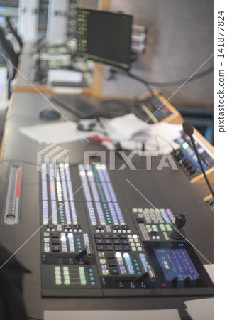 Professional television broadcast control room desk with video switcher and copy space Professional television broadcast control room desk with video switcher and copy space 141877824