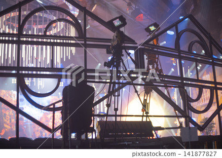 Professional camera crew filming live event on concert stage with copy space Professional camera crew filming live event on concert stage with copy space 141877827