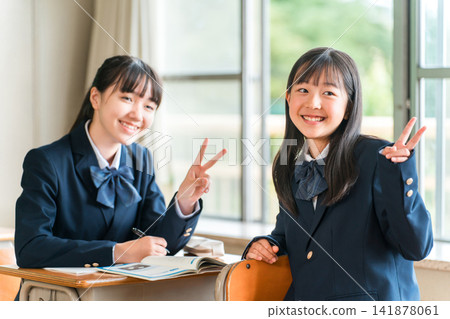 Elementary, middle, and high school students talking with friends, classmates, and peers in the classroom during lessons and recess. Elementary, middle, and high school students talking with friends, classmates, and peers in the classroom during lessons and recess. 141878061