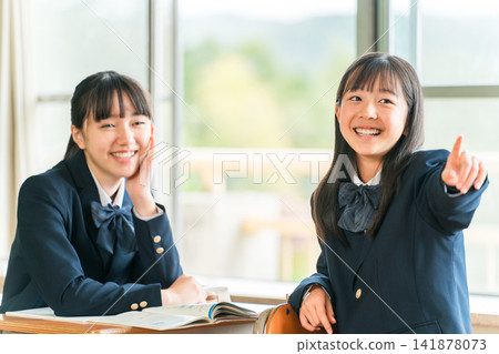 Elementary, middle, and high school students talking with friends, classmates, and peers in the classroom during lessons and recess. Elementary, middle, and high school students talking with friends, classmates, and peers in the classroom during lessons and recess. 141878073