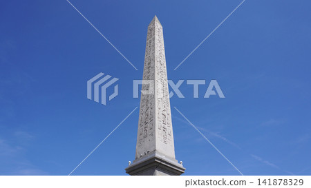 The Luxor Obelisk in Place de la Concorde, Paris, against a blue sky. The Luxor Obelisk in Place de la Concorde, Paris, against a blue sky. 141878329