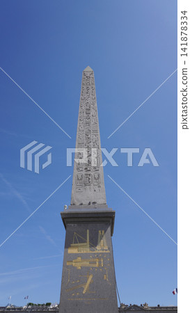 The Luxor Obelisk in Place de la Concorde, Paris, against a blue sky. The Luxor Obelisk in Place de la Concorde, Paris, against a blue sky. 141878334