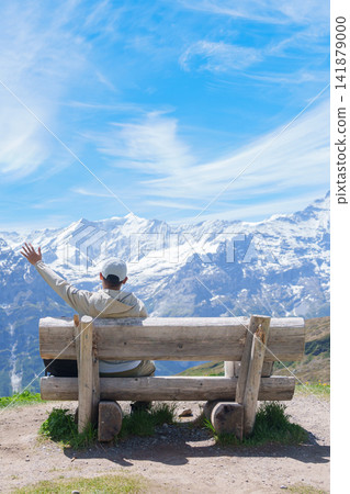 man Tourist Explore Grindelwald First, Switzerland in Summer. Happy Hiker Sit on Bench with Swiss Alps in Jungfrau Region. Famous Tourist Attraction, Travel Destination and Hiking Trail in Europe man Tourist Explore Grindelwald First, Switzerland in Summer. Happy Hiker Sit on Bench with Swiss Alps in Jungfrau Region. Famous Tourist Attraction, Travel Destination and Hiking Trail in Europe 141879000