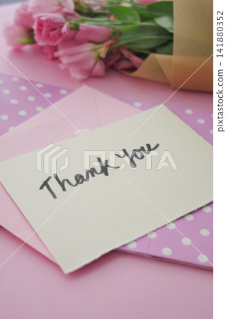 Thank you note with flowers on a pink background 141880352