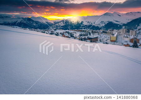Ski tracks in the deep snow at sunrise, France Ski tracks in the deep snow at sunrise, France 141880368