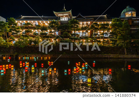 Colorful lanterns float down the Matsukawa River in front of the Tokaikan [Ito City, Shizuoka Prefecture] - Scenery of Izu 141880374