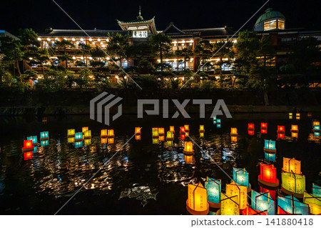 Colorful lanterns float down the Matsukawa River in front of the Tokaikan [Ito City, Shizuoka Prefecture] - Scenery of Izu 141880418