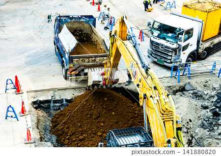 Construction site vehicles: Excavator and dump truck - High color saturation contrast Construction site vehicles: Excavator and dump truck - High color saturation contrast 141880820