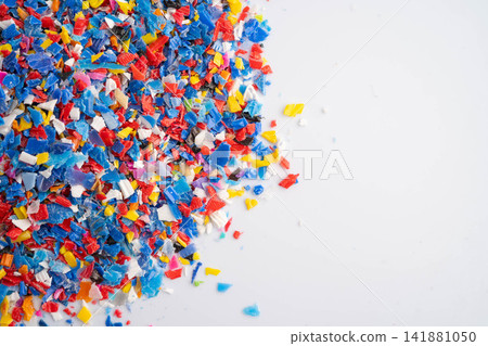 Plastic colorful pieces recycling shredded for industrial use. Plastic colorful pieces recycling shredded for industrial use. 141881050