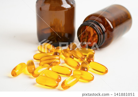 Fish oil or Cod liver oil gel in capsules with omega 3 vitamins, supplementary healthy food. Fish oil or Cod liver oil gel in capsules with omega 3 vitamins, supplementary healthy food. 141881051