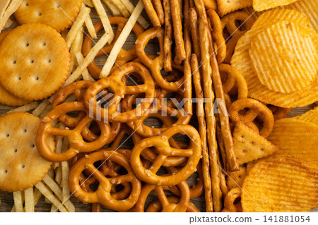 Mix of variety snack chips pretzel and cracker, junk crunchy food. Mix of variety snack chips pretzel and cracker, junk crunchy food. 141881054