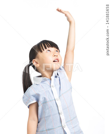 Little girl raising hand to measure height for growth concept Little girl raising hand to measure height for growth concept 141881658