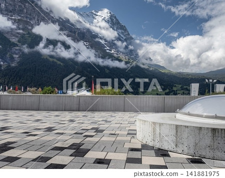 Views of the Eiger North Face and the Alps from a modern observation terrace in Grindelwald, Switzerland. Views of the Eiger North Face and the Alps from a modern observation terrace in Grindelwald, Switzerland. 141881975