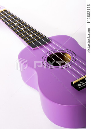 Four string ukulele guitar on white background Four string ukulele guitar on white background 141882118