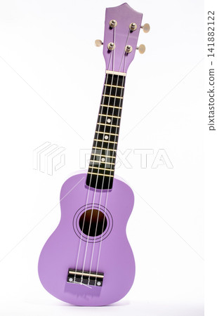 Four string ukulele guitar on white background Four string ukulele guitar on white background 141882122