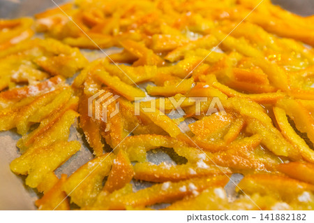 Top view of homemade candied orange peels drying Top view of homemade candied orange peels drying 141882182