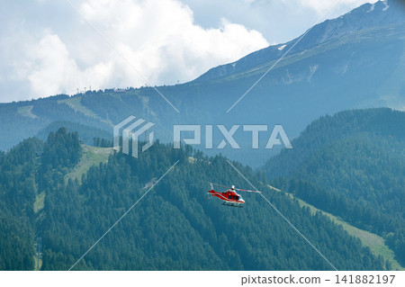 Bansko, Bulgaria red medical emergency helicopter flying over green Pirin mountains Bansko, Bulgaria red medical emergency helicopter flying over green Pirin mountains 141882197