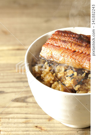 A single photo of a piping hot mini eel rice bowl. A single photo of a piping hot mini eel rice bowl. 141882243