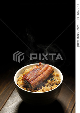 A single photo of a piping hot mini eel rice bowl. A single photo of a piping hot mini eel rice bowl. 141882285