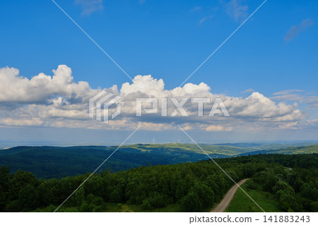 Winding Road and Wind Farm Landscape Winding Road and Wind Farm Landscape 141883243