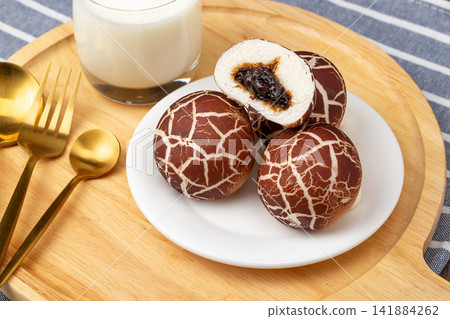 creative mushroom shaped steamed buns with sweet custard filling creative mushroom shaped steamed buns with sweet custard filling 141884262