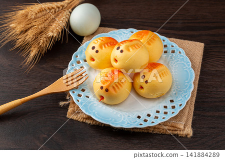 assorted cute chick shaped steamed buns with sweet custard filling assorted cute chick shaped steamed buns with sweet custard filling 141884289