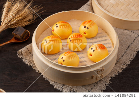 assorted cute chick shaped steamed buns with sweet custard filling assorted cute chick shaped steamed buns with sweet custard filling 141884291